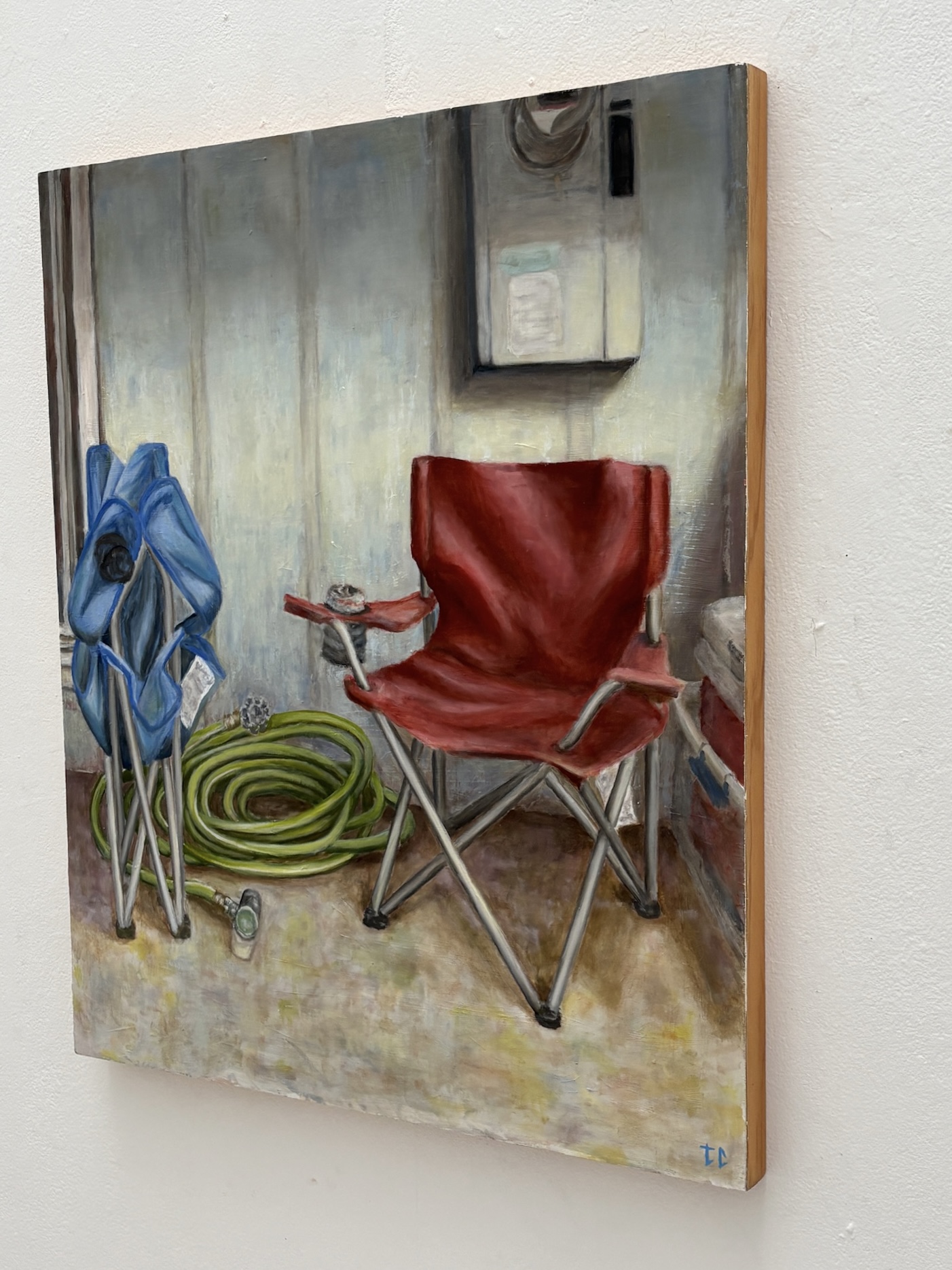 Oil painting of folding chairs, a garden hose, and an outdoor wall detail view
