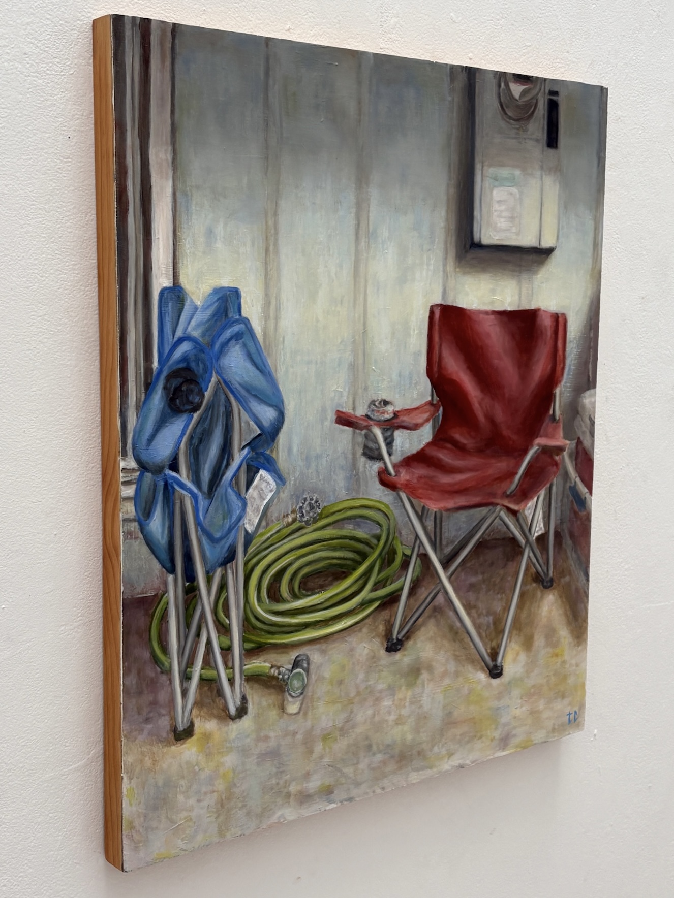 Oil painting of folding chairs, a garden hose, and an outdoor wall detail view