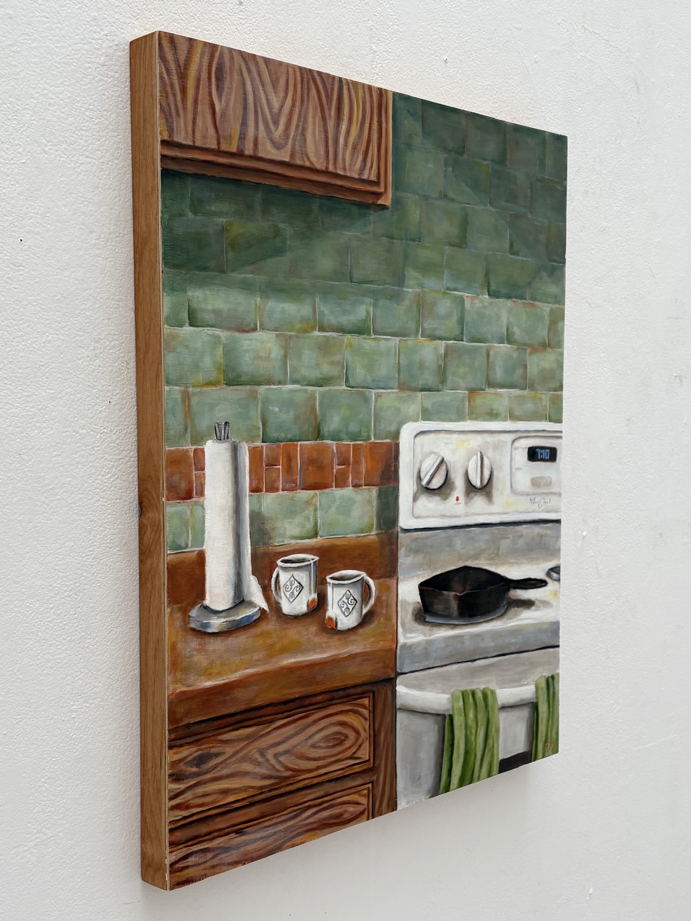 Oil painting of a kitchen stove, mugs, and green tile detail view